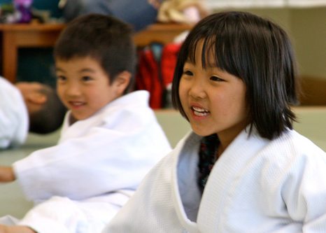 Two students smiling during Ann Arbor Kids Karate class
